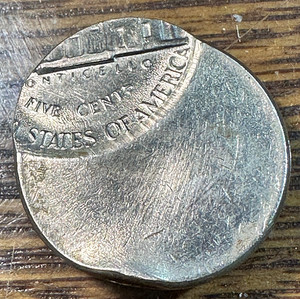 2019 nickel off-center strike error showing coin design shifted from center with blank planchet crescent visible